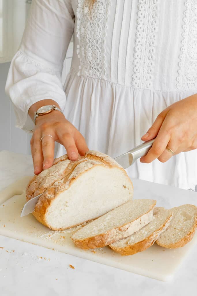 Cutting the crusty sourdough.