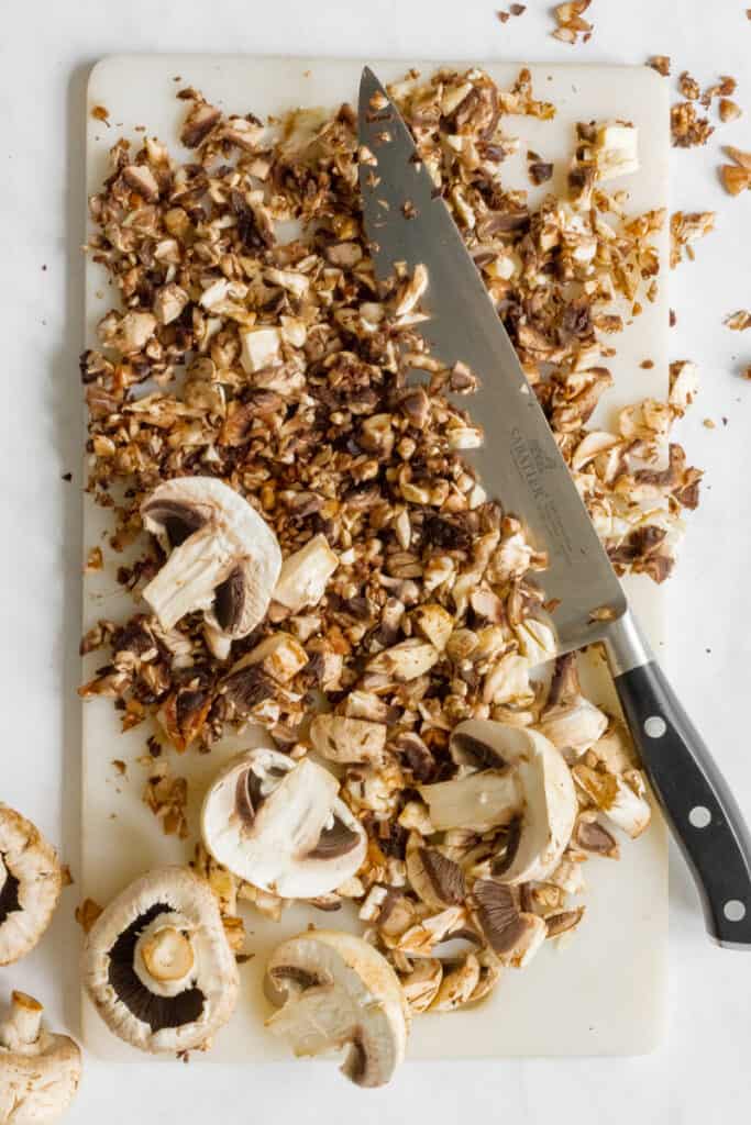 Chopped Mushrooms on a Chopping Board.