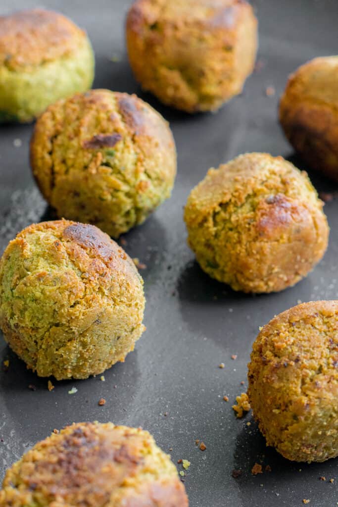 Cooked falafel in a frying pan.