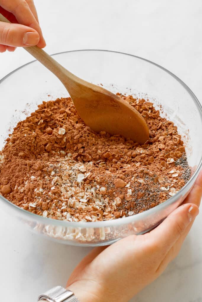 Stirring the dry ingredients together in a bowl.