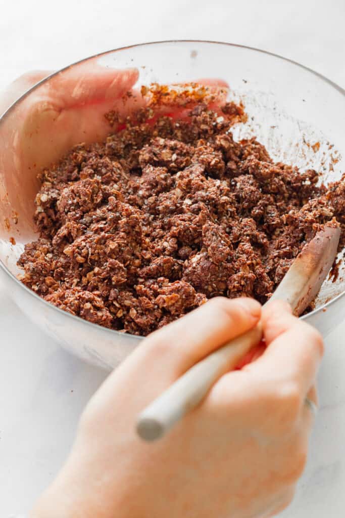 Mixing together the chocolate flapjack mixture.