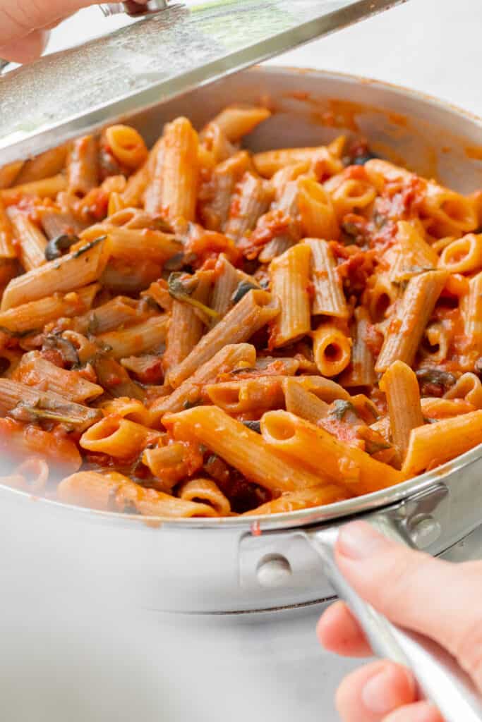 Removing the lid from the One-Pot Sun-Dried Tomato Pasta - Vegan, GF & Healthy! Georgie Eats 