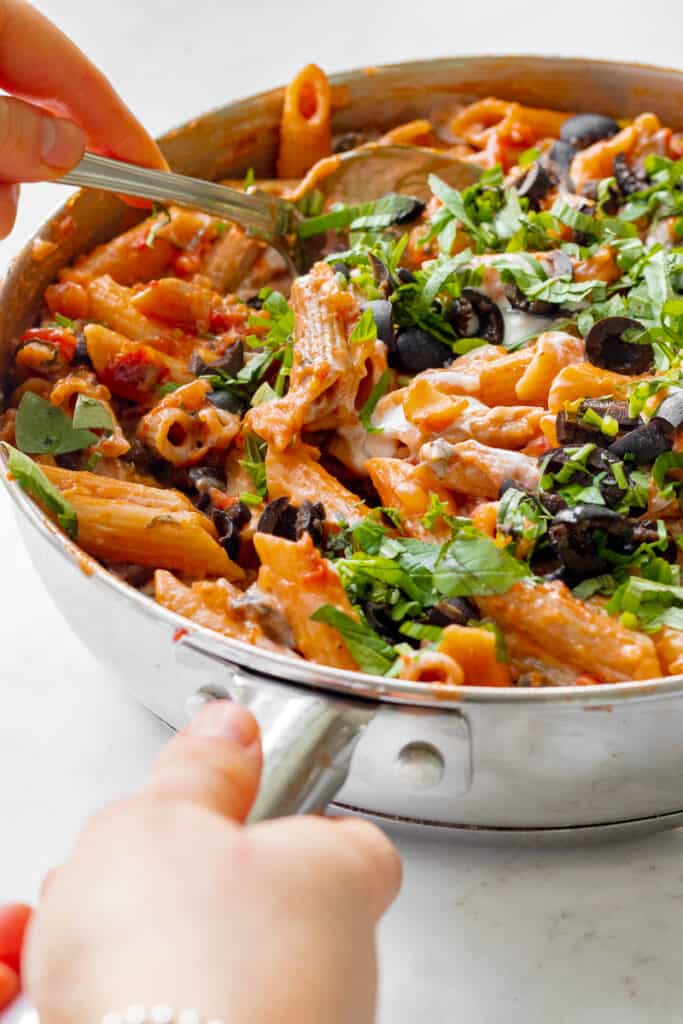Taking a spoonful of One-Pot Sun-Dried Tomato Pasta - Vegan, GF & Healthy! Georgie Eats 