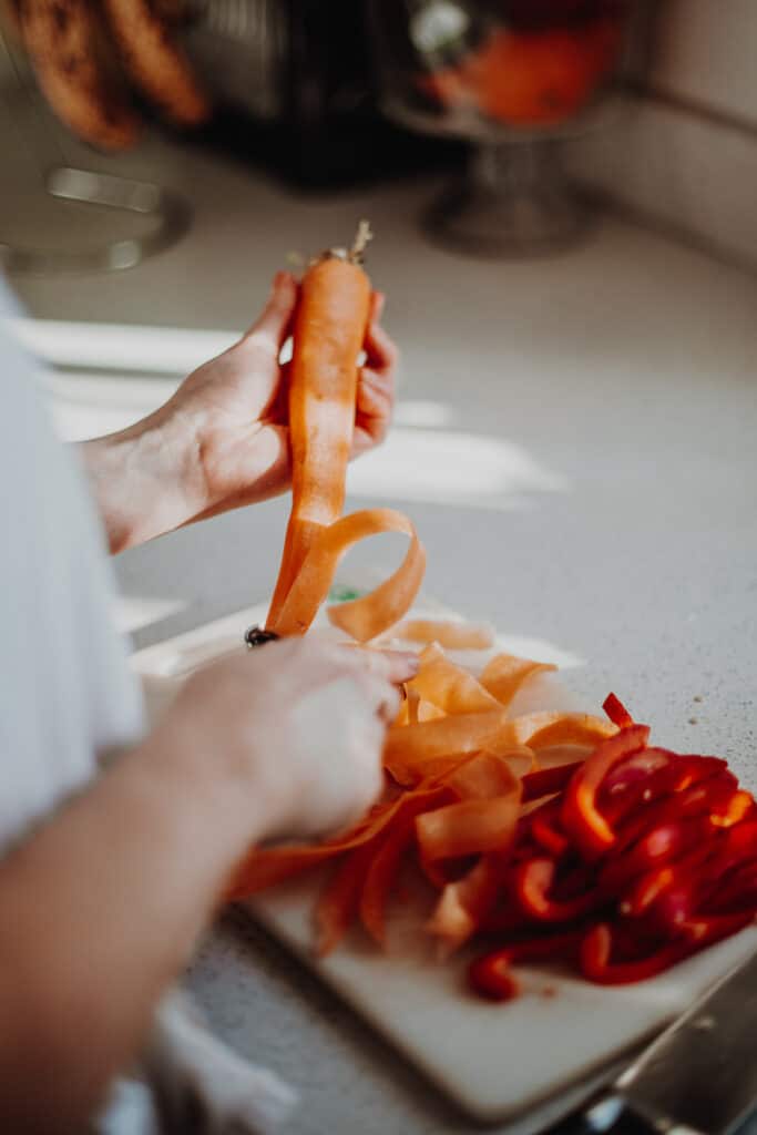 Peeling the carrot into ribbons.