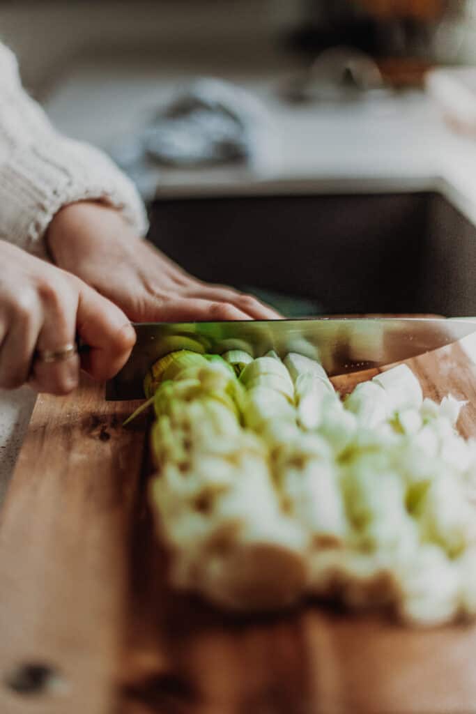 chopping leeks into slices