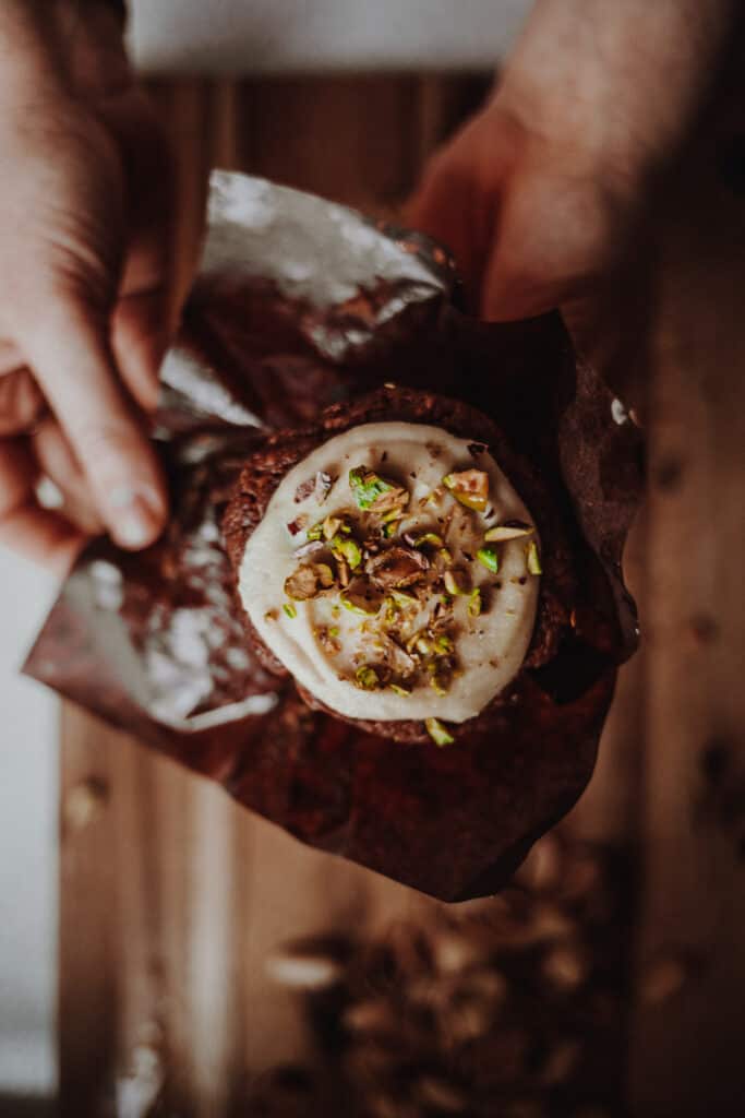 Unwrapping a Sweet potato Muffins with Maple Cashew Frosting - Vegan, GF & Healthy! Georgie Eats.