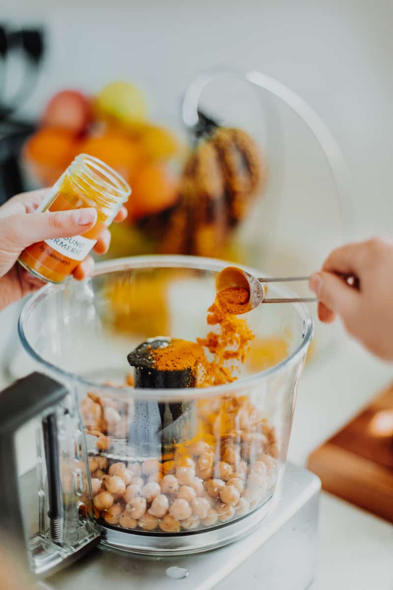 Adding the tumeric into the hummus