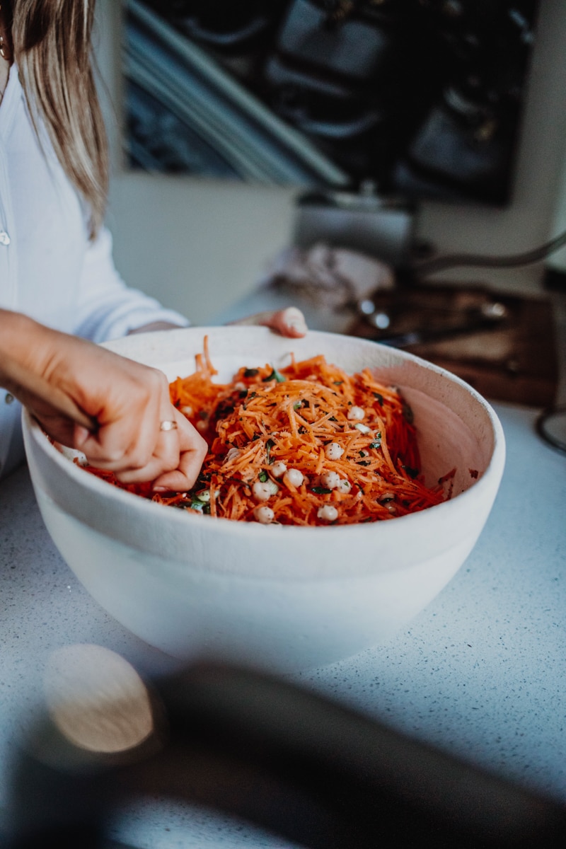 Mixing the carrot & chickpea salad