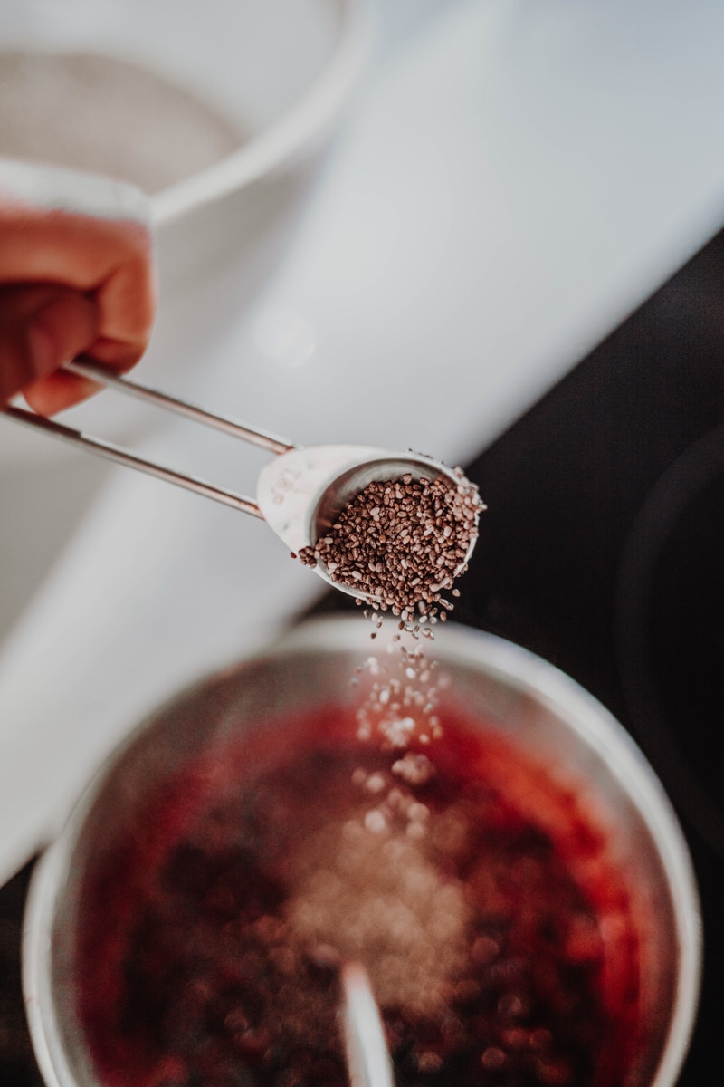 adding the chia seeds into the blackberries