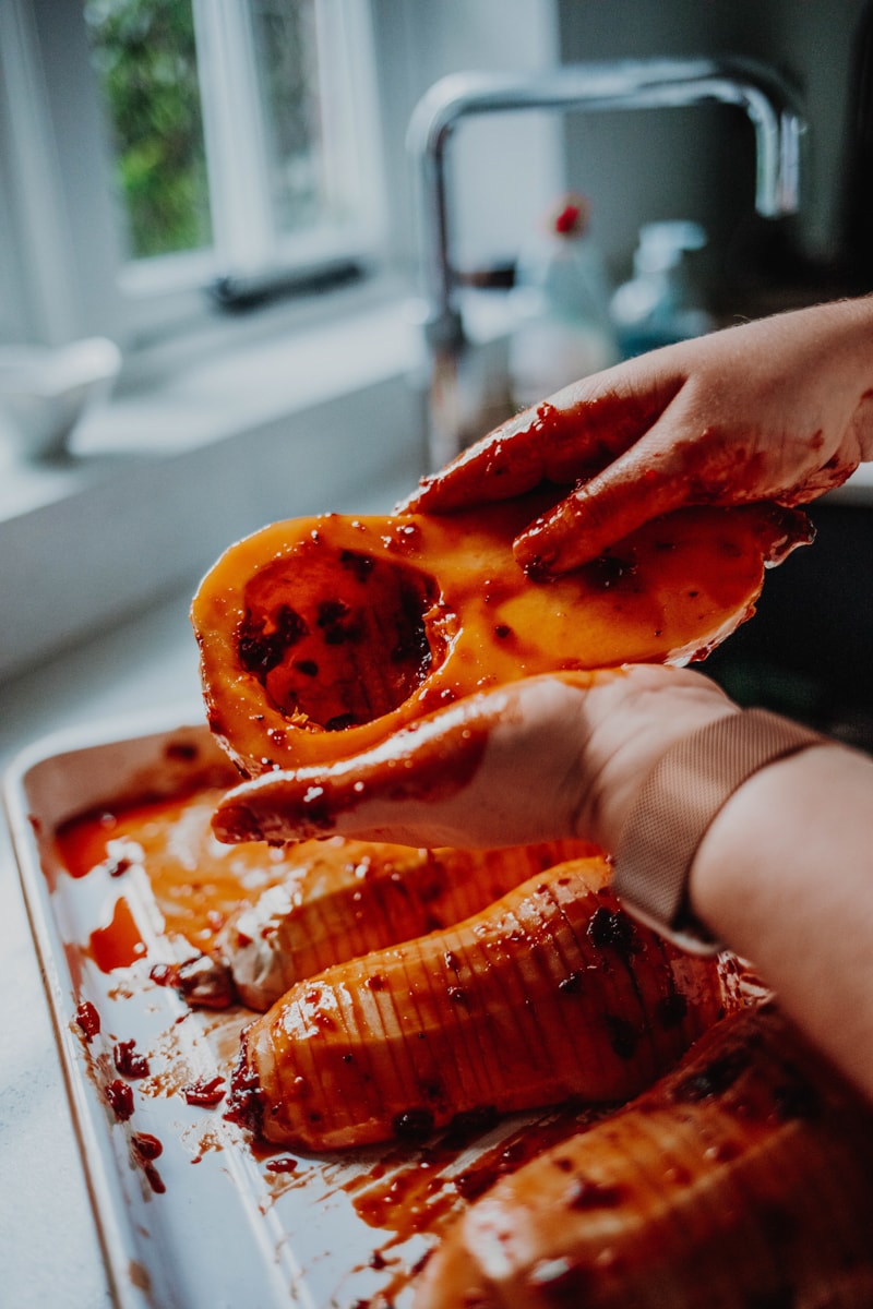rubbing the marinade over the squash