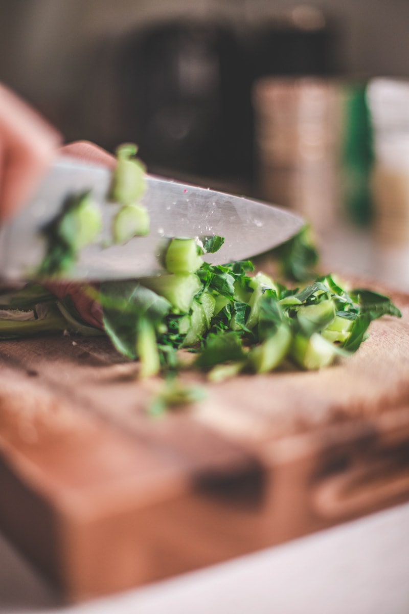 thinly slicing cauliflower leaves
