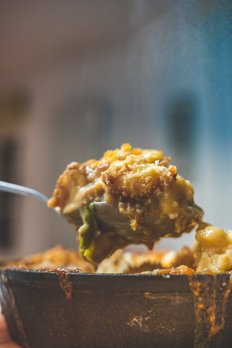 Cauliflower Cheese & Gnocchi Bake Coming being spooned from dish - Georgie Eats