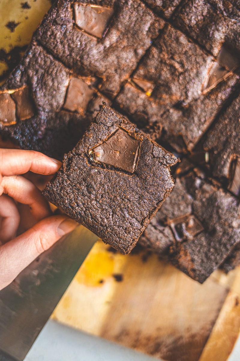 Vegan Chocolate Orange Brownies being cut - Georgie Eats