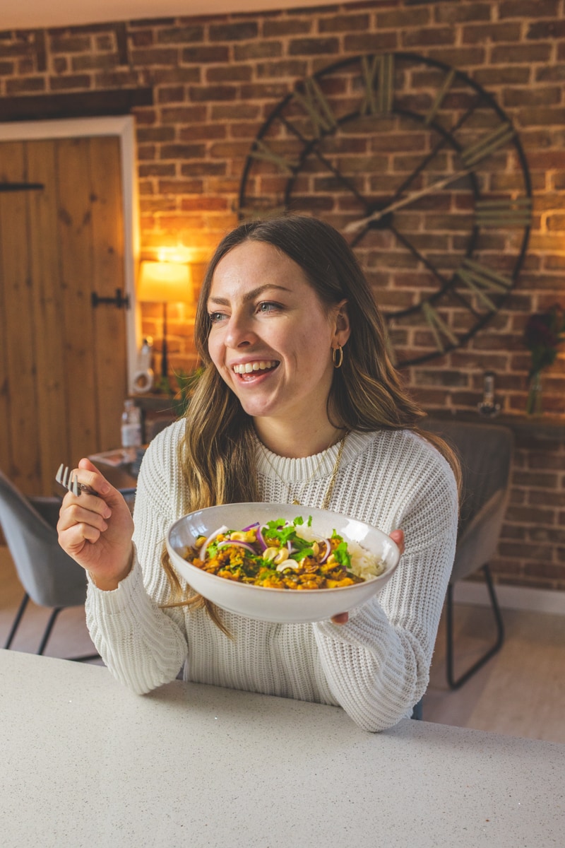 Georgie with The Best Vegan Roasted Cauliflower Curry - Georgie Eats
