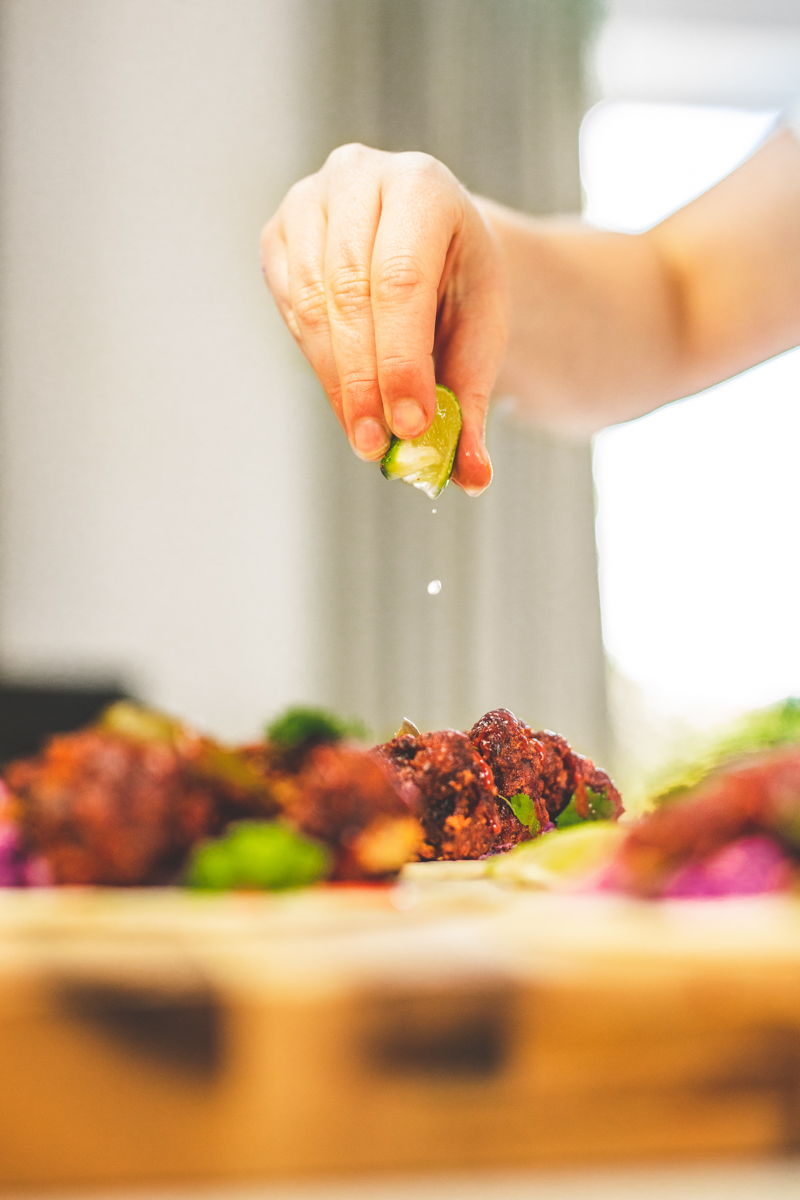 Squeezing lime on Crispy BBQ Broccoli Tacos - Georgie Eats