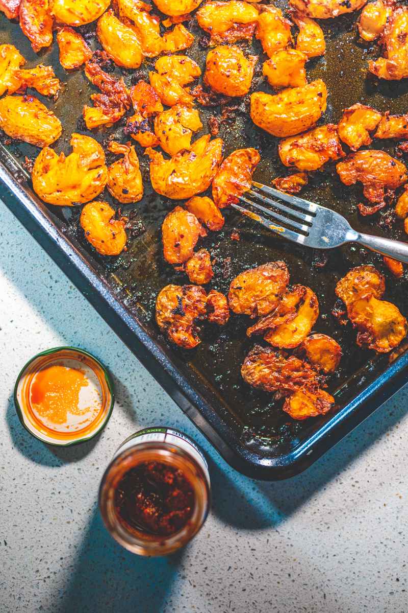 Smashed Harissa Potatoes - Georgie Eats