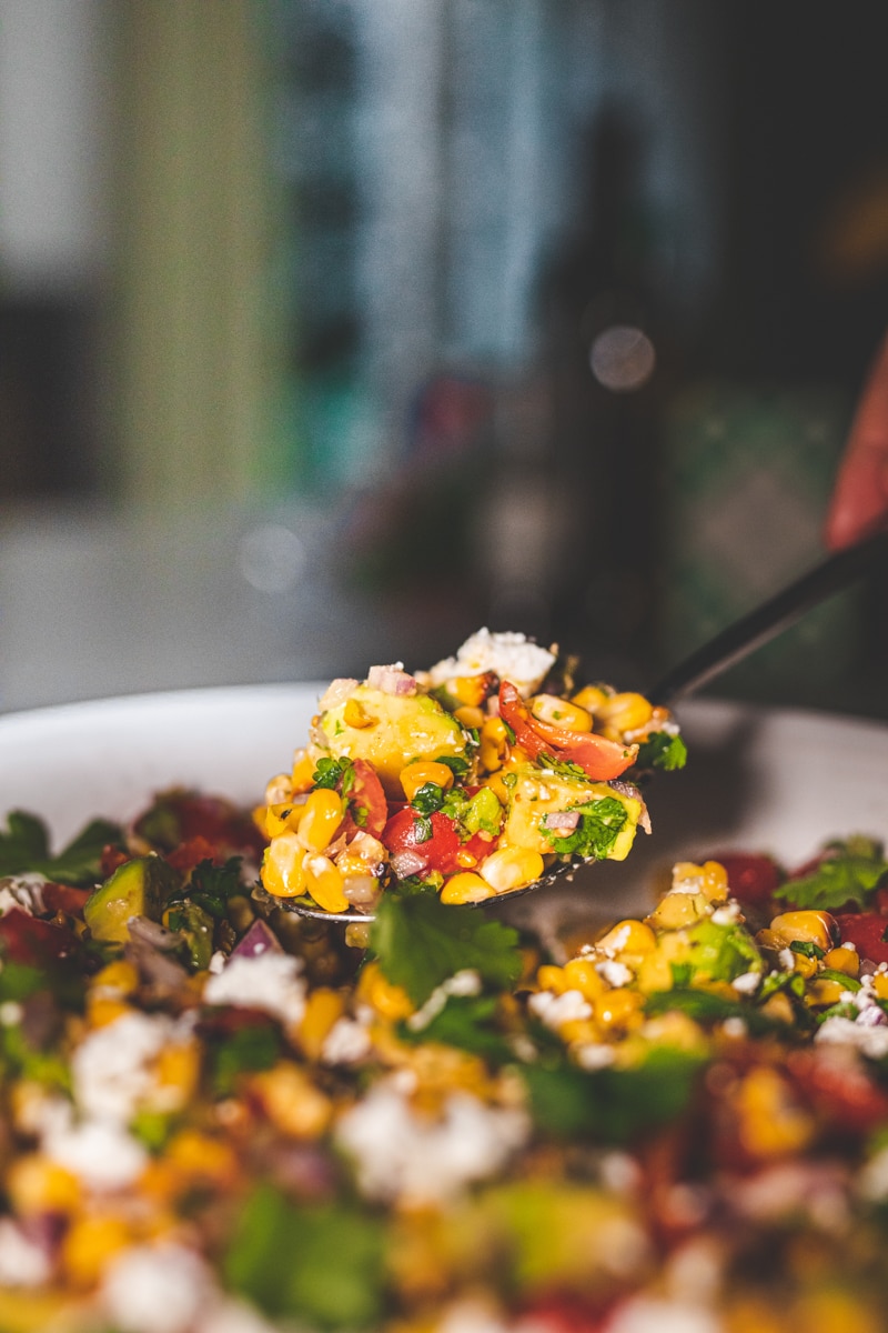 A spoonful of Charred Corn & Avocado Salad - Georgie Eats