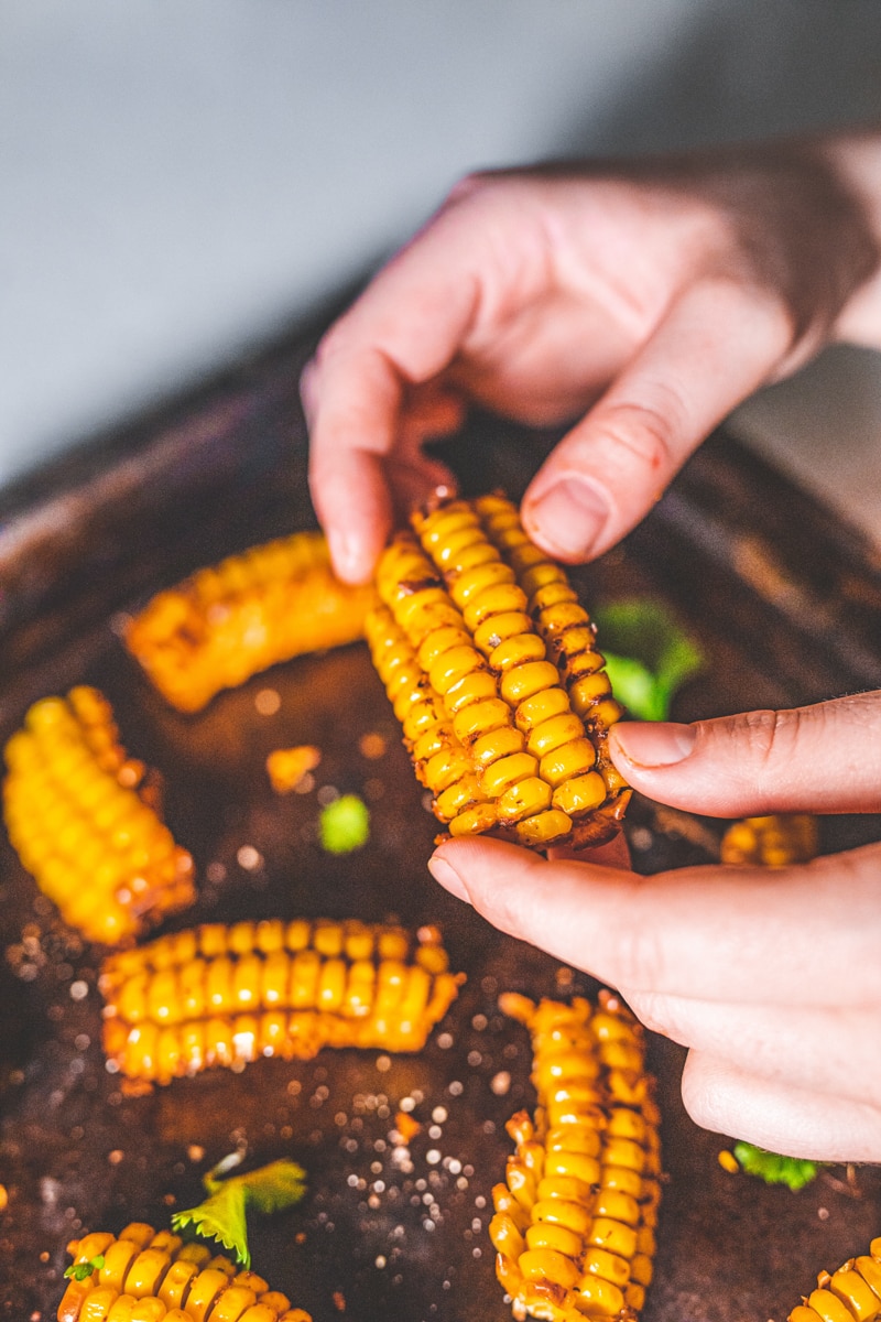 Holding Baked Corn Ribs - Georgie Eats