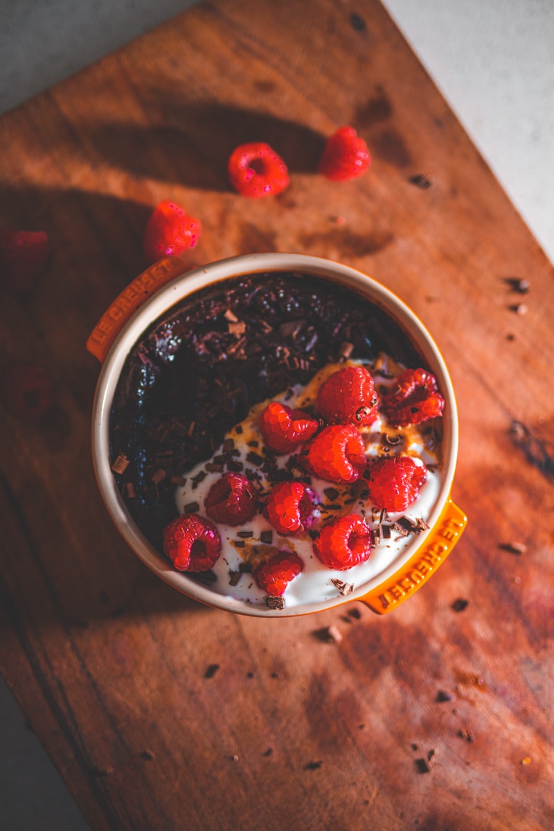 A Spoonful of Chocolate Cake Baked Oats on a board - Georgie Eats