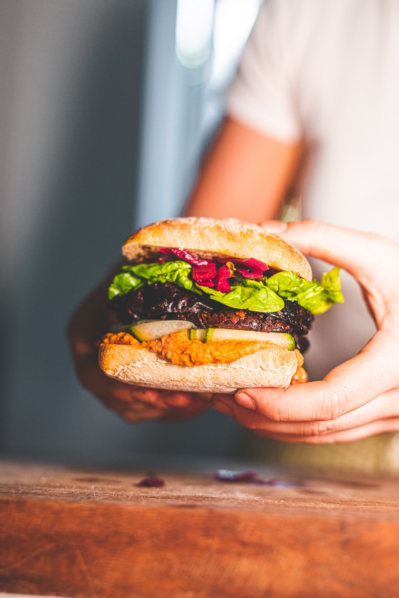 Holding the Hummus & Harissa Aubergine Sandwiches - Georgie Eats