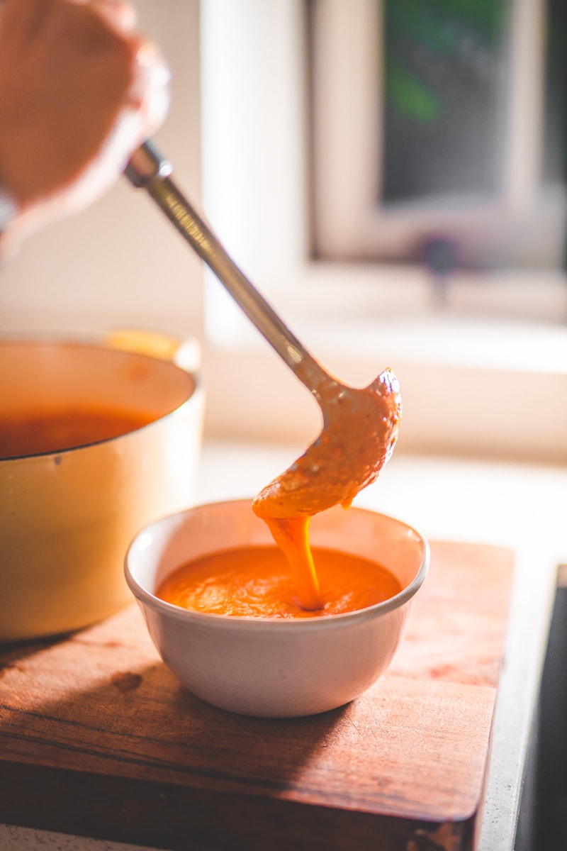 Serving the Roasted Tomato & Harissa Soup - Georgie Eats