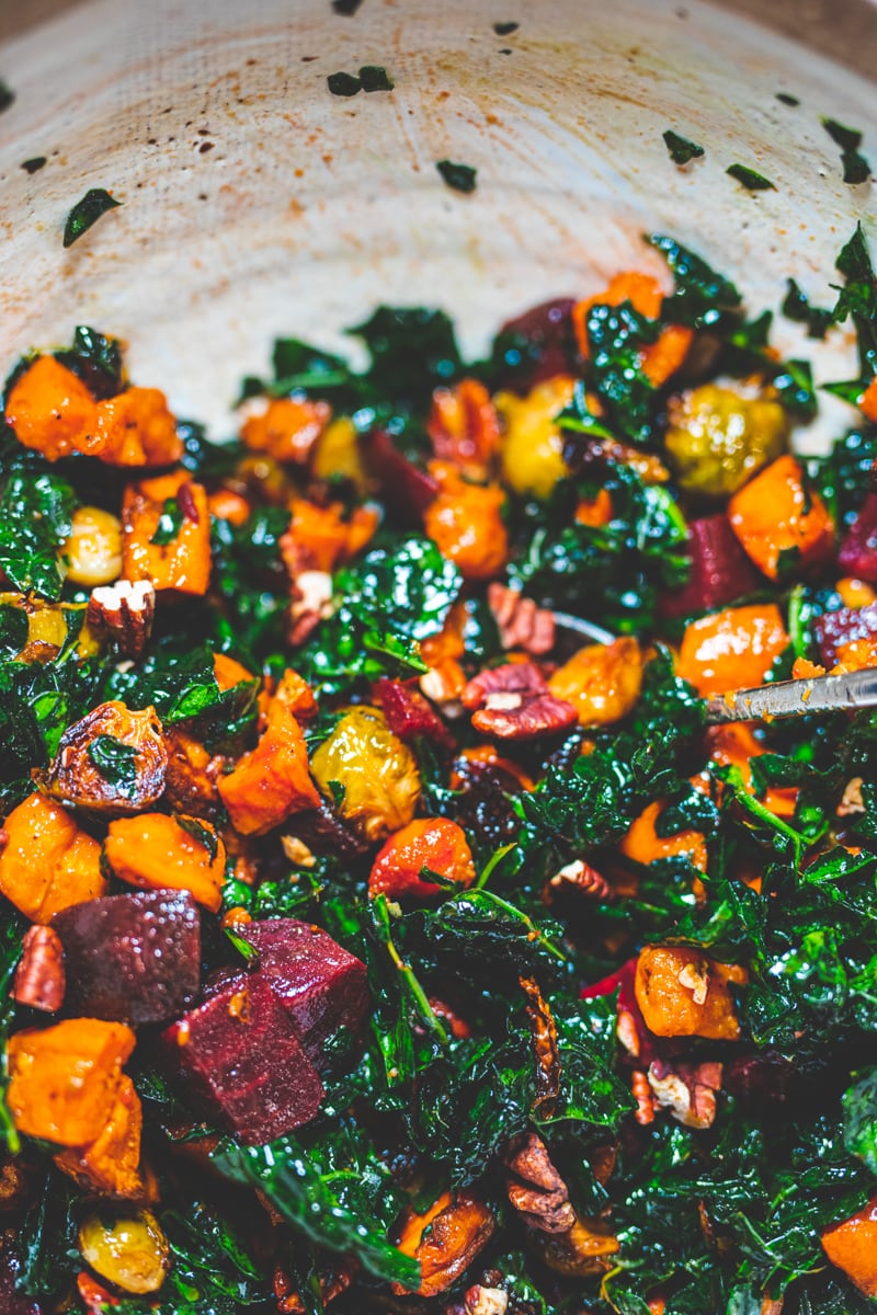 Stirring my favourite roasted vegetable Winter Salad - Georgie Eats