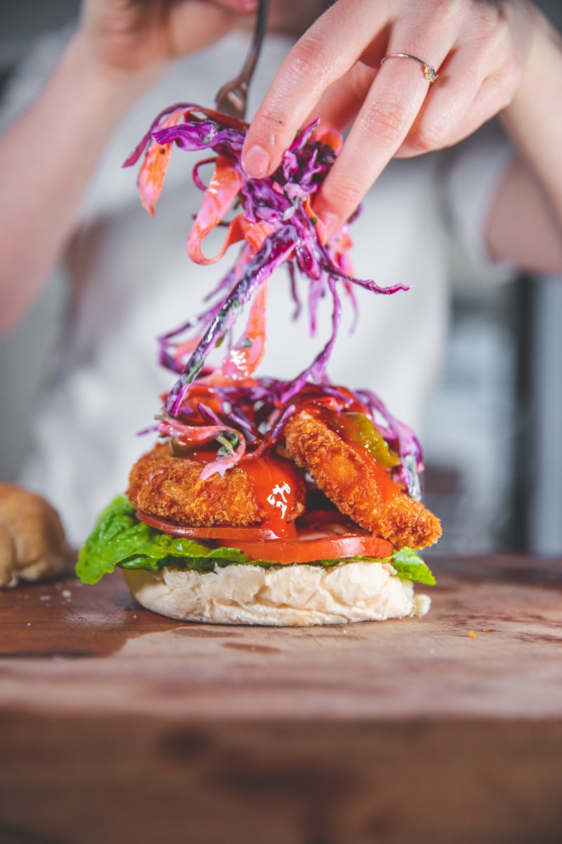 Adding Slaw to Buffalo Tofu Sandwich - Georgie Eats