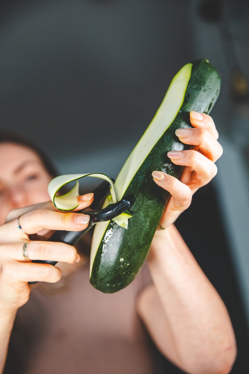 Peeling courgette for Raw Courgette Salad - Georgie Eats