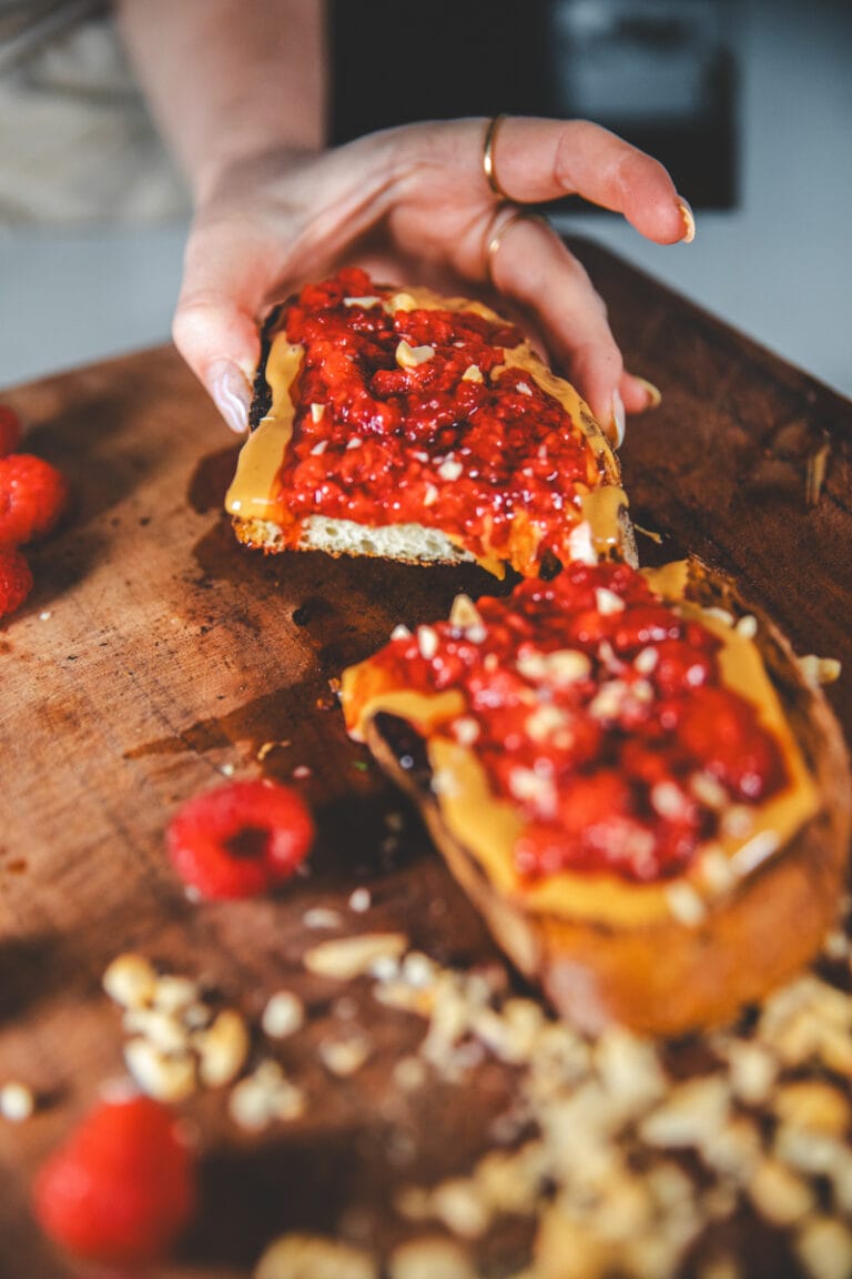 a slice of Peanut Butter & Roasted Raspberry Toast -Georgie Eats