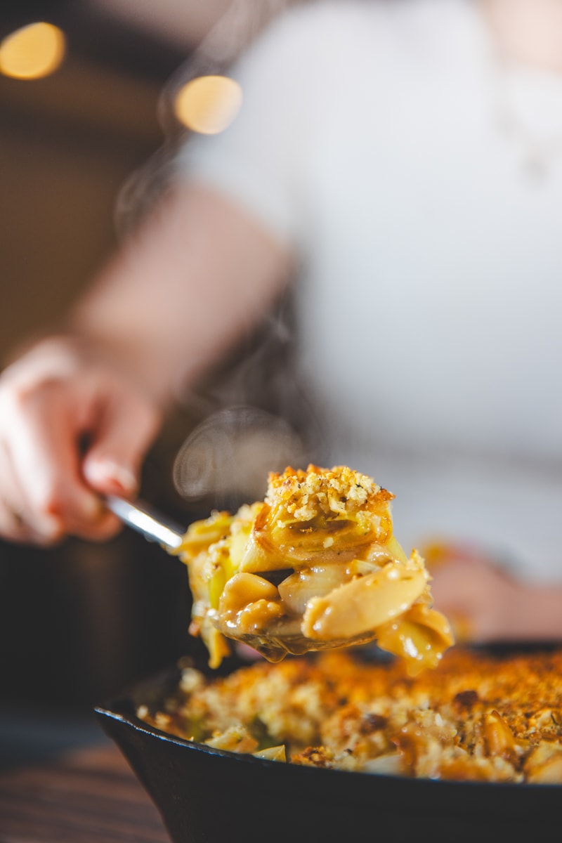 A scoop of Leek & Butter Bean Gratin - Georgie Eats