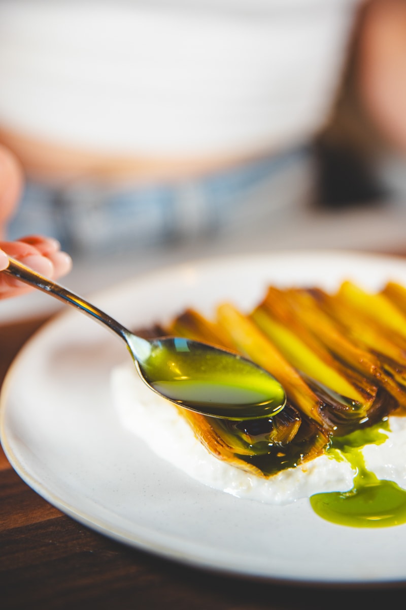 Finishing the Braised Leeks & Herb Oil - Georgie Eats