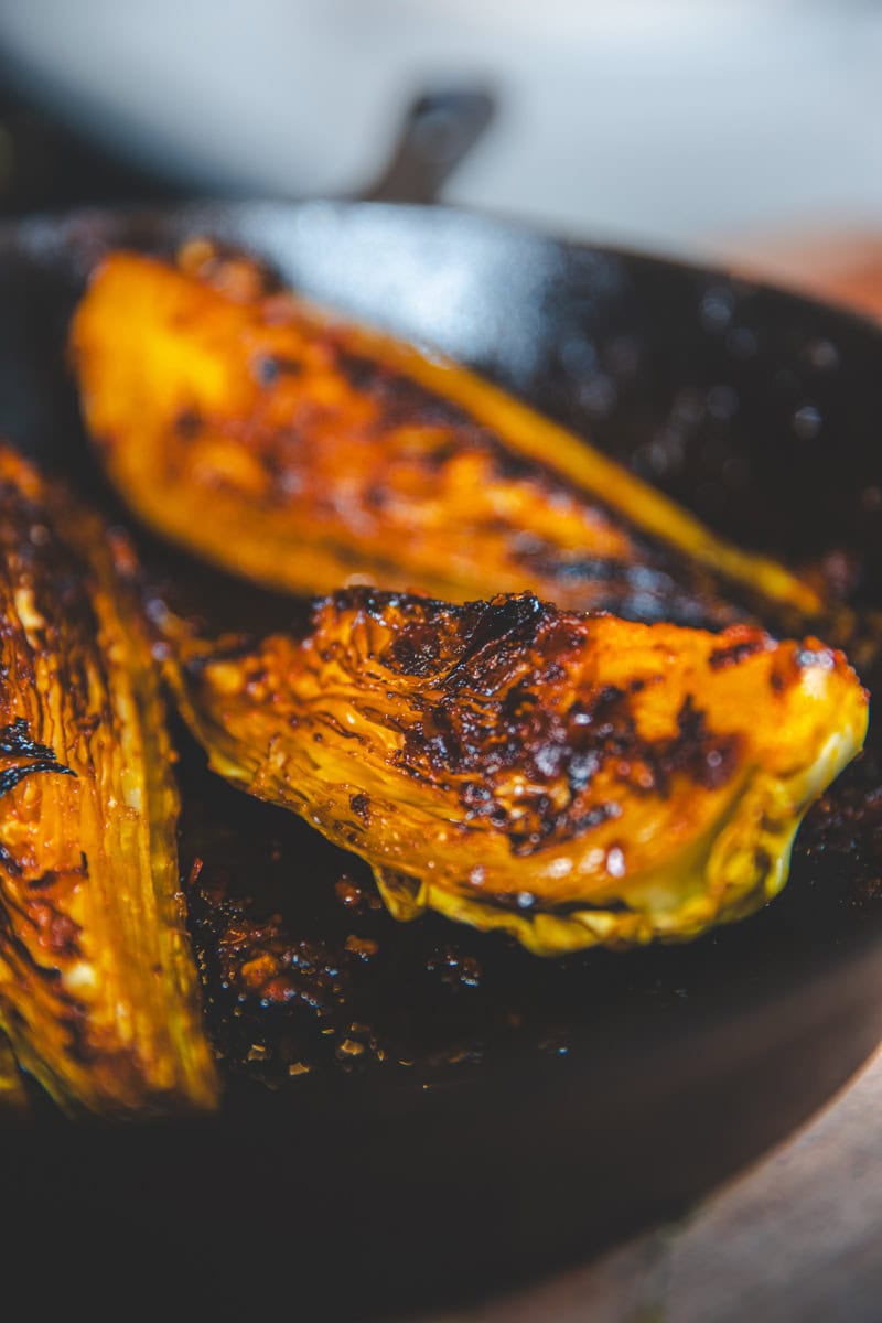 Harissa Hispi Cabbage in a pan - Georgie Eats