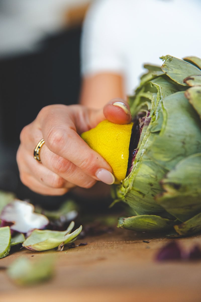 Rubbing the globe artichoke with lemon - Georgie Eats