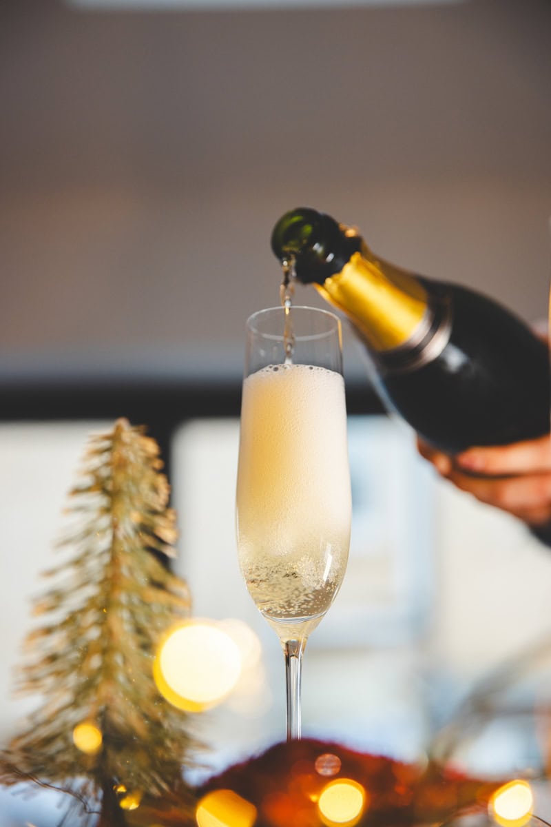 Pouring the Clementine & Thyme Mimosa - Georgie Eats