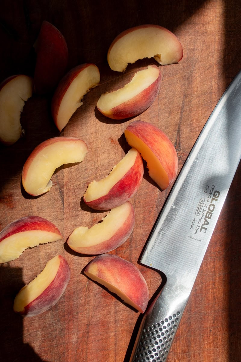 peaches on a cutting board